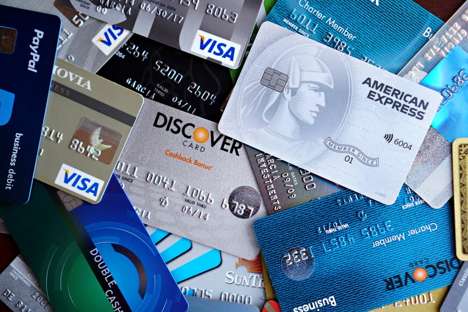 credit cards beside a debt payoff worksheet and calculator